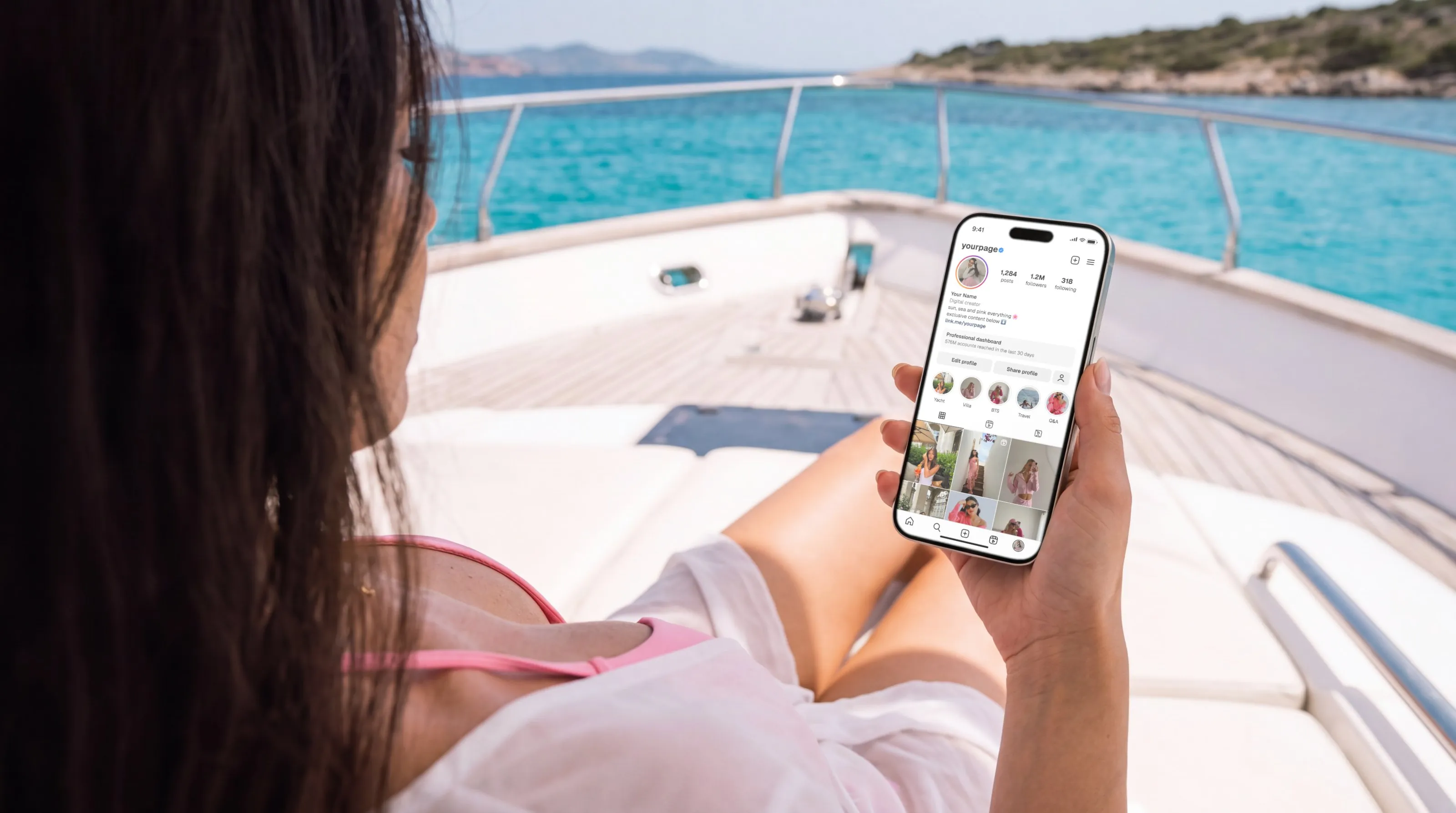 Creator relaxing on a yacht with her phone, the sea behind her